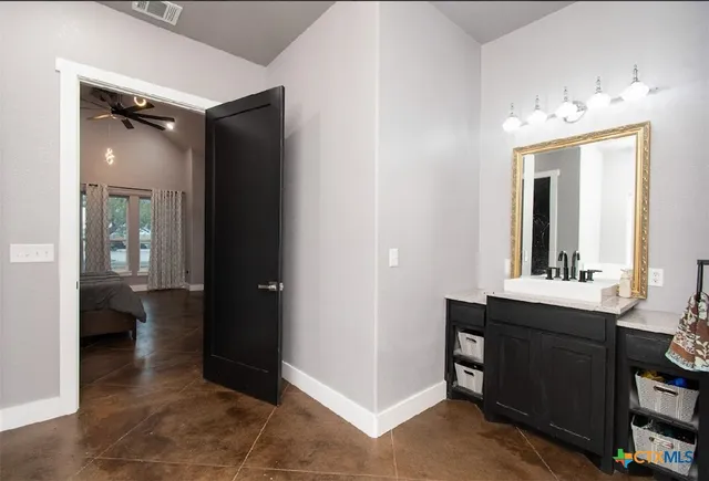 a view of a bathroom from the hallway