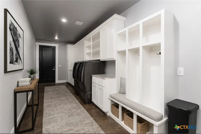 a bedroom with a bed wooden floor and window