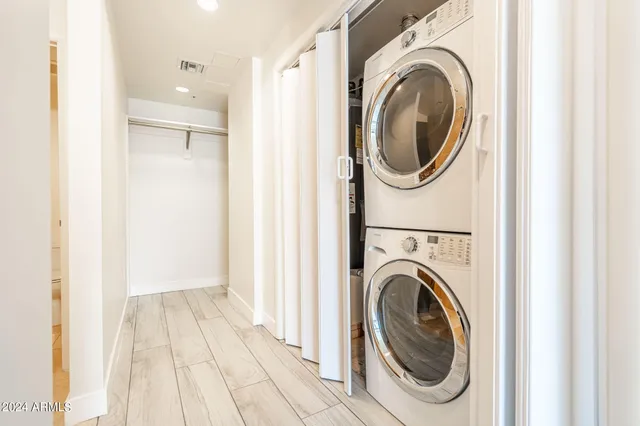a view of a hallway with washer and dryer