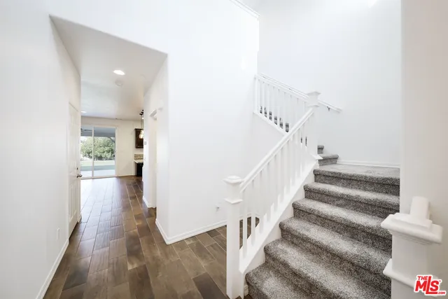 a bathroom with a sink toilet and a mirror