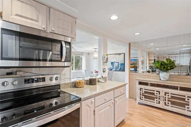 a kitchen with sink stove and cabinets