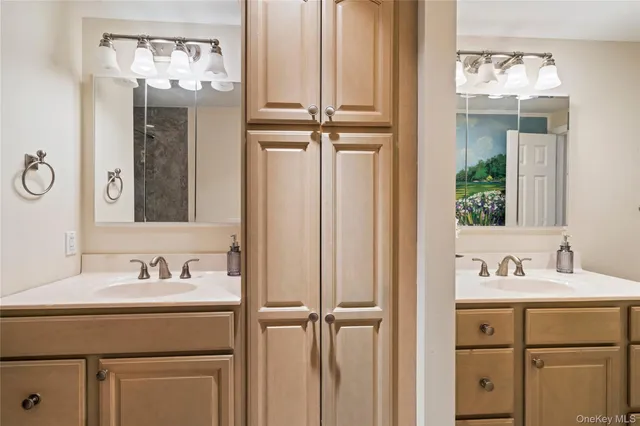 a bathroom with a sink a vanity and a mirror