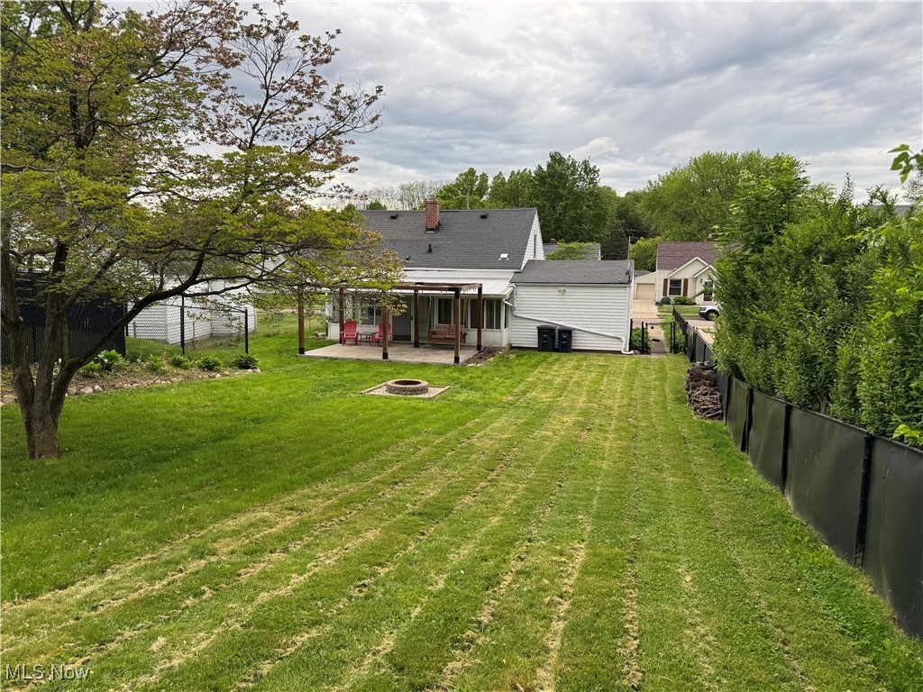 1139 Kessel Avenue Akron, OH 44310 - Photo 30 of 36 View of yard featuring a fire pit, a patio area, and a pergola