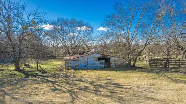 a house view with swimming pool next to a yard