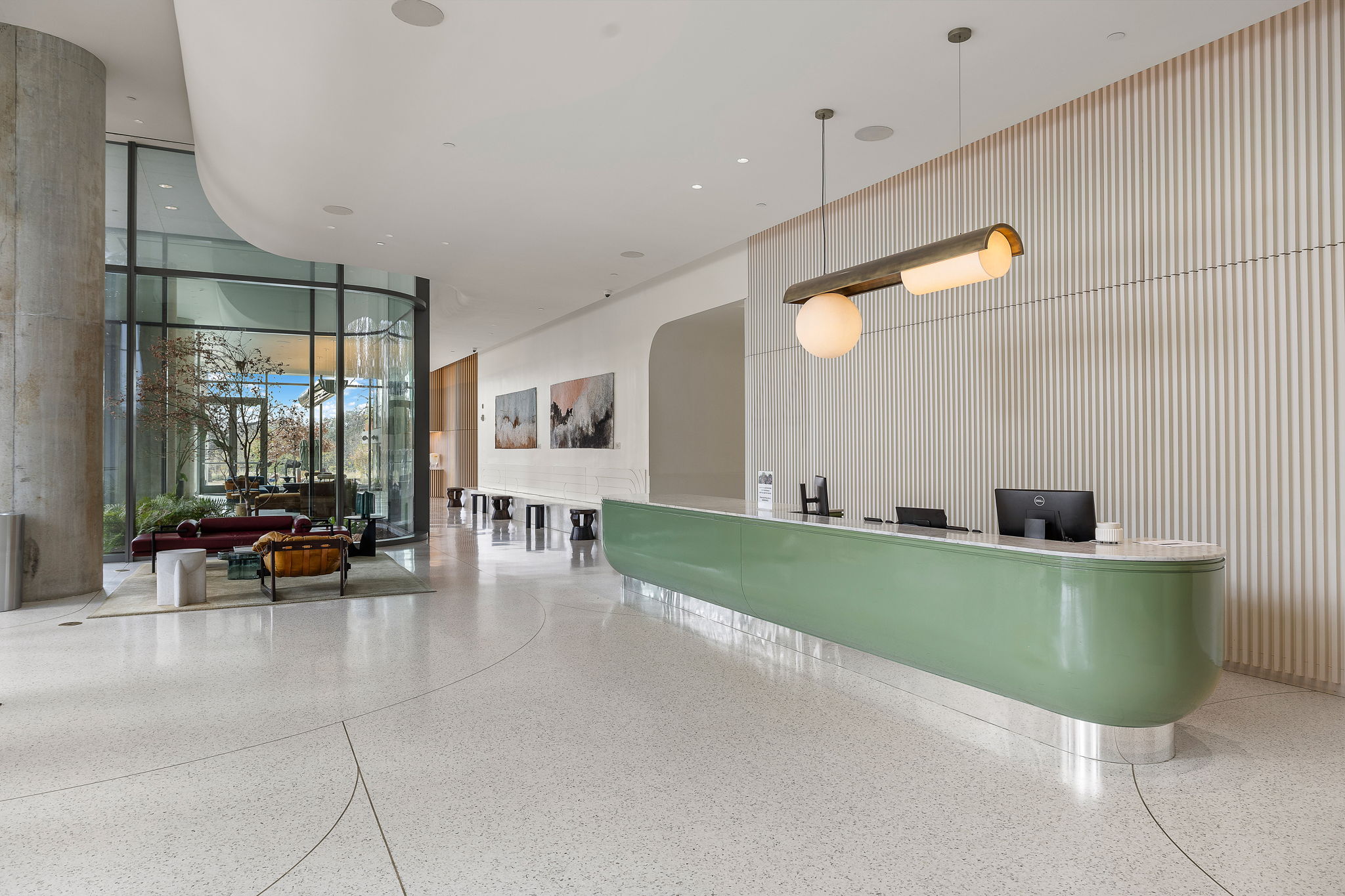 44 East Avenue, Unit 1210 Austin, TX 78701 - Photo 18 of 40 Reception area with a high ceiling and floor to ceiling windows