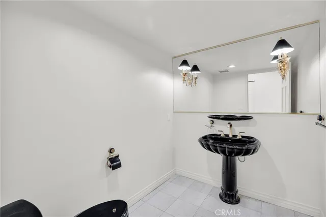 a kitchen with stainless steel appliances granite countertop a refrigerator stove and oven