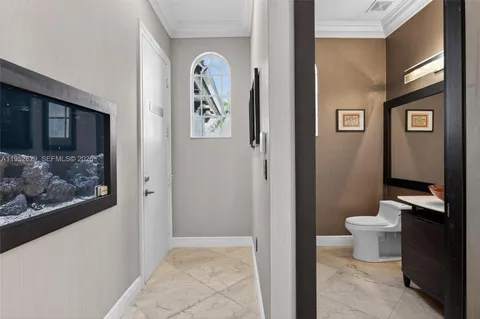 a view of a bathroom with a sink and mirror