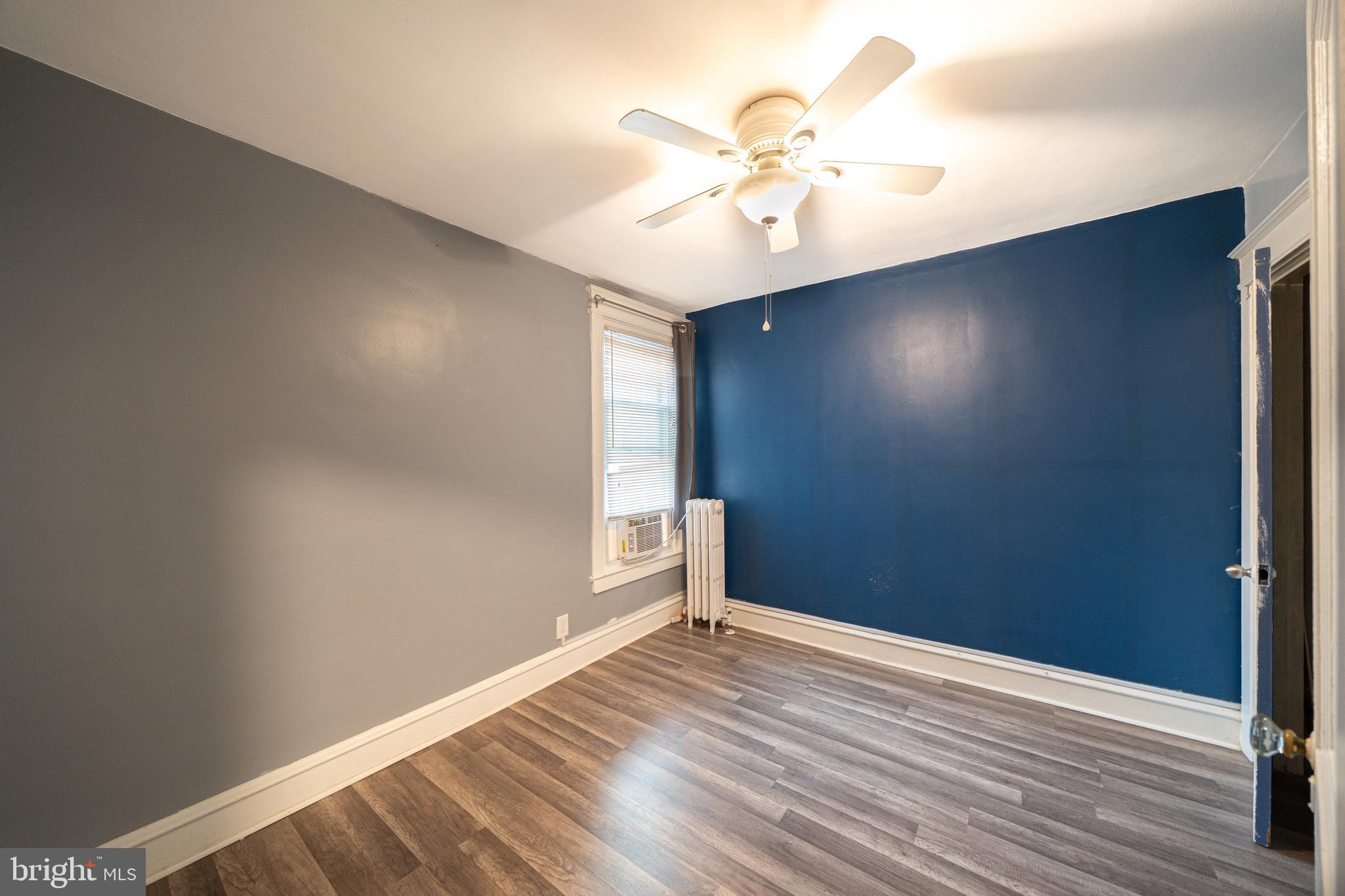 4141 Stirling Street Philadelphia, PA 19135 - Photo 16 of 24 an empty room with wooden floor closet and fan