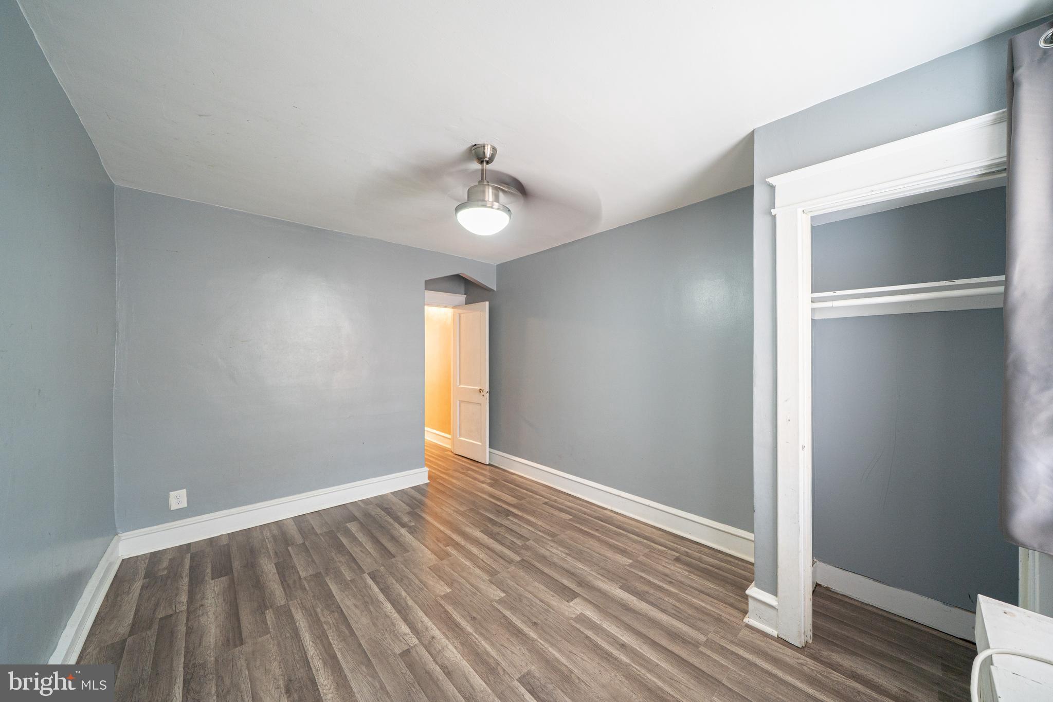 4141 Stirling Street Philadelphia, PA 19135 - Photo 19 of 24 a view of an empty room with window and wooden floor
