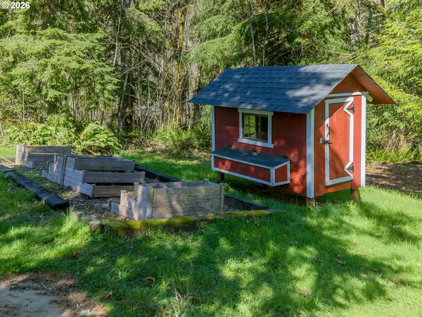 a view of a wooden house with a yard