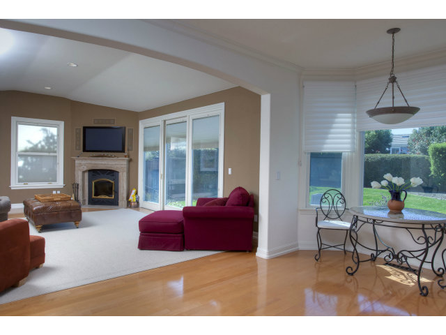 151 Cypress Point Road Half Moon Bay, CA 94019 - Photo 14 of 25 a living room with furniture a window and a fireplace