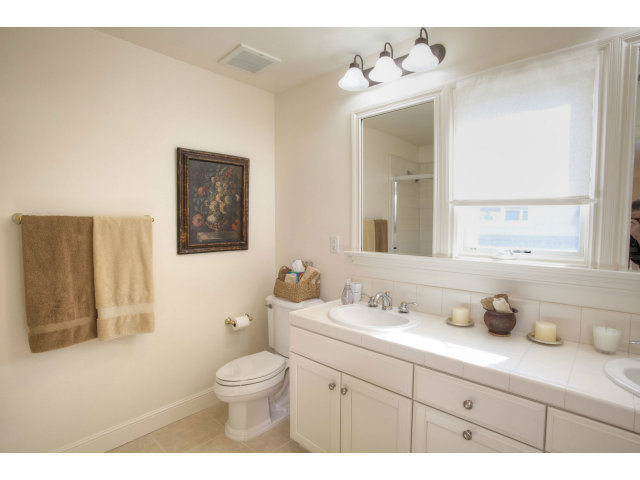 151 Cypress Point Road Half Moon Bay, CA 94019 - Photo 20 of 25 a bathroom with a double vanity sink mirror and toilet