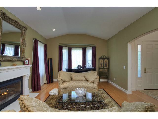 151 Cypress Point Road Half Moon Bay, CA 94019 - Photo 4 of 25 a living room with furniture and a fireplace