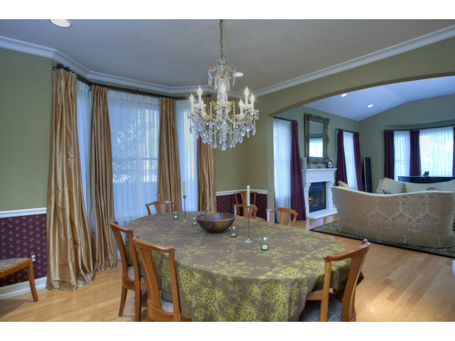 151 Cypress Point Road Half Moon Bay, CA 94019 - Photo 7 of 25 a view of a dining room with furniture and a chandelier