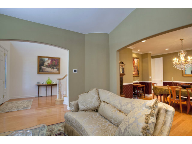 151 Cypress Point Road Half Moon Bay, CA 94019 - Photo 8 of 25 a living room with furniture and a dining table with wooden floor