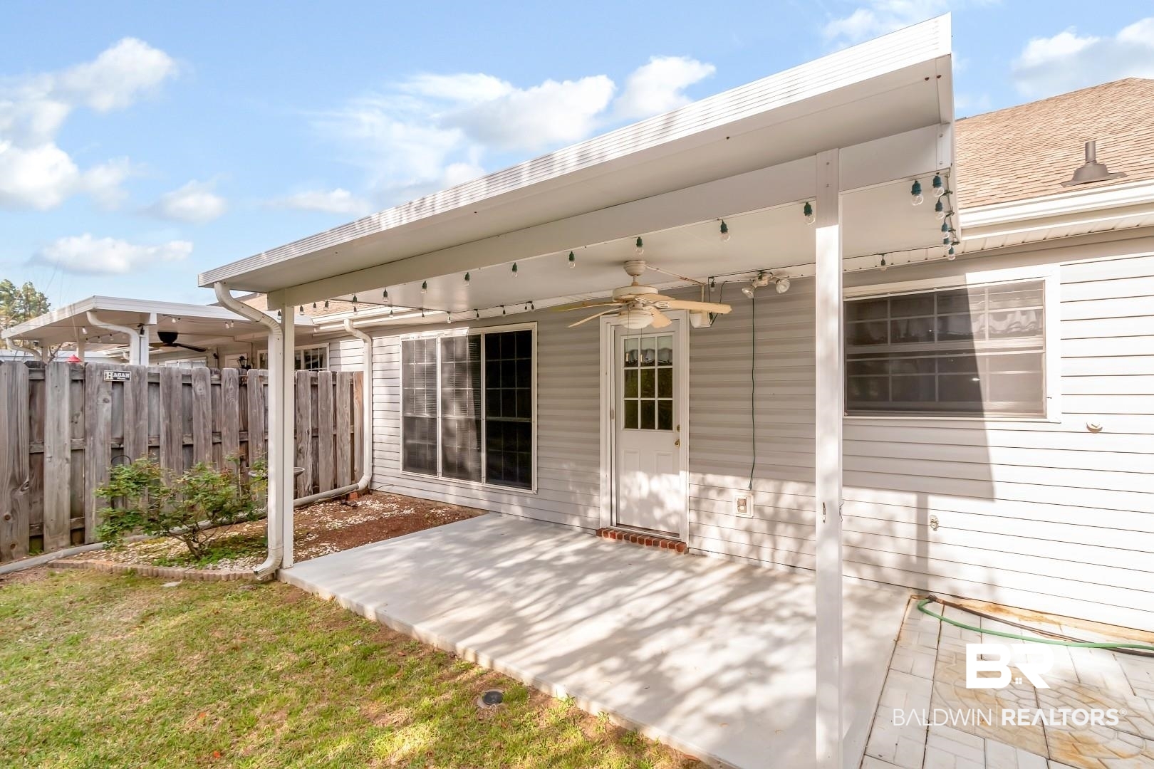672 Spring Lake Drive East Mobile, AL 36695 - Photo 6 of 26 View of patio / terrace with a ceiling fan and fence