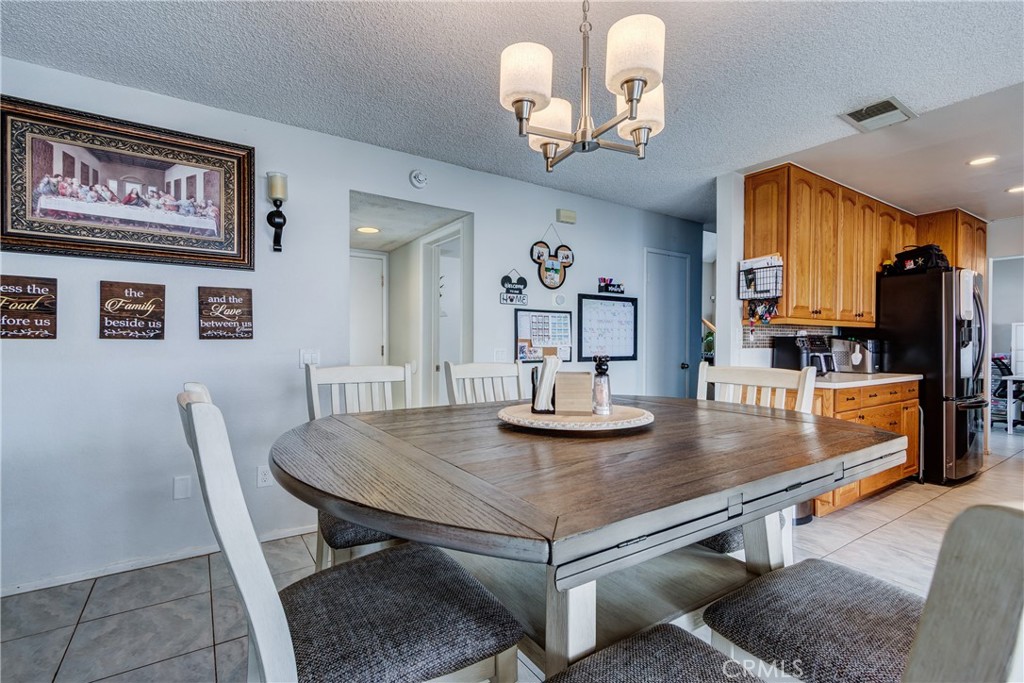 25588 Pelion Road Menifee, CA 92584 - Photo 15 of 43 a view of a dining room with furniture