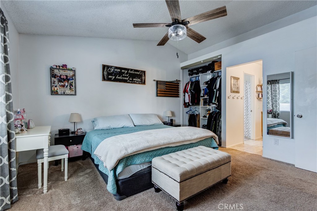 25588 Pelion Road Menifee, CA 92584 - Photo 23 of 43 a living room with furniture and a bed