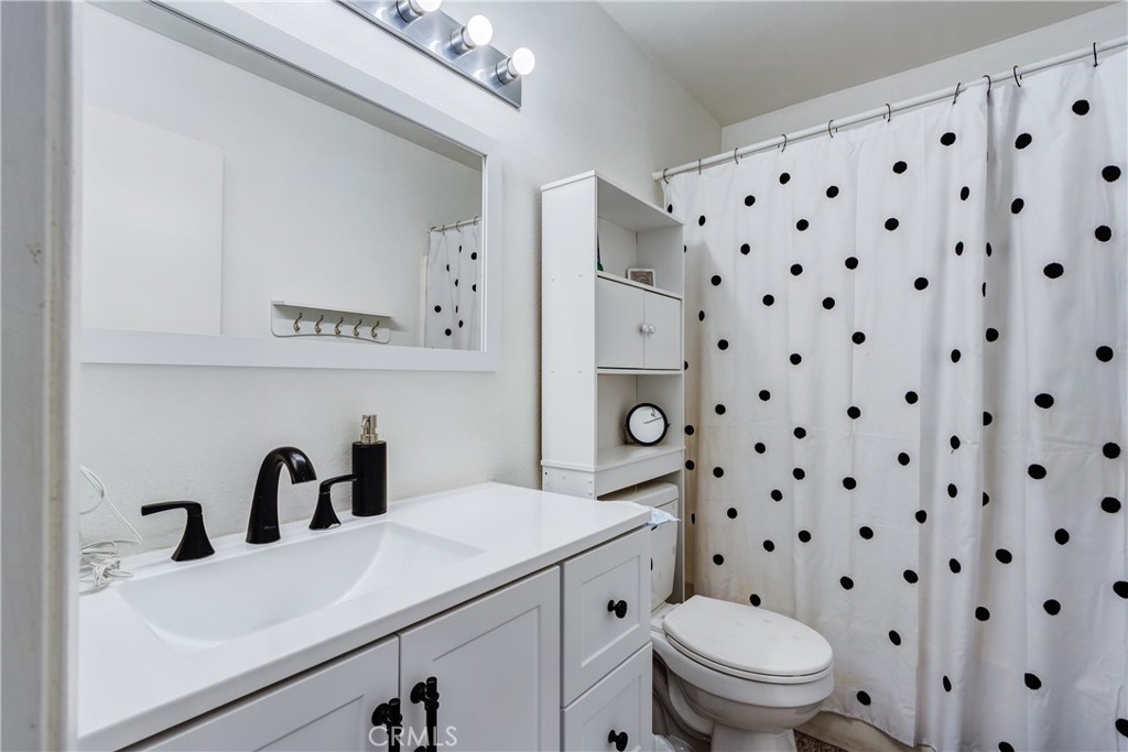 25588 Pelion Road Menifee, CA 92584 - Photo 28 of 43 a bathroom with a sink toilet and shower