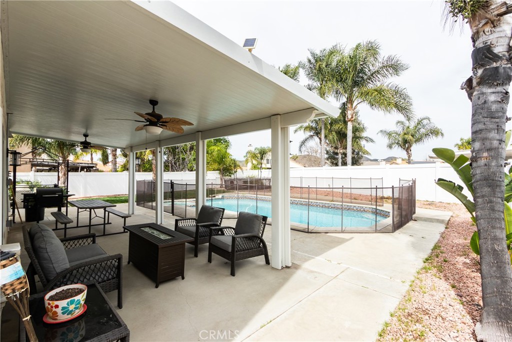 25588 Pelion Road Menifee, CA 92584 - Photo 32 of 43 a bedroom with furniture and a potted plant