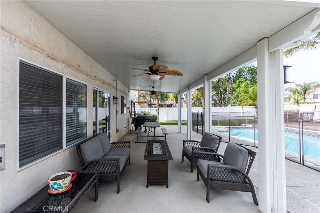 25588 Pelion Road Menifee, CA 92584 - Photo 33 of 43 a living room with furniture and a large window