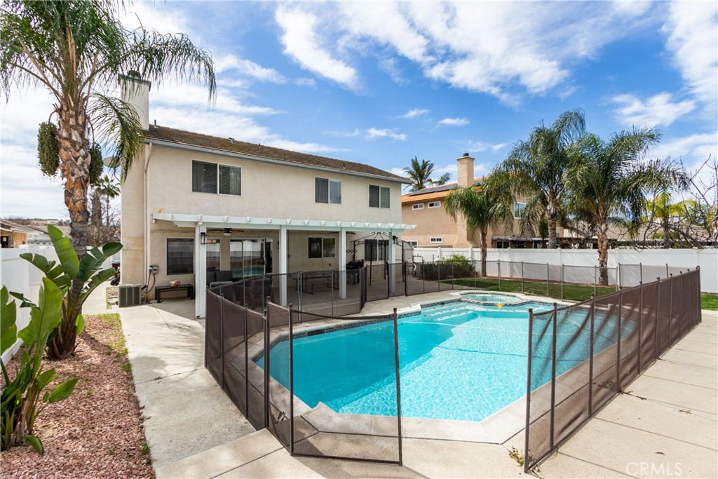 25588 Pelion Road Menifee, CA 92584 - Photo 35 of 43 a view of a house with backyard and swimming pool