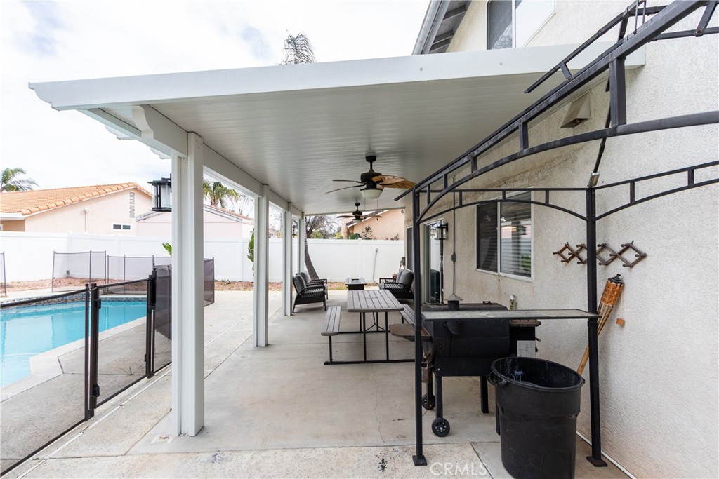 25588 Pelion Road Menifee, CA 92584 - Photo 40 of 43 a view of a patio with table and chairs