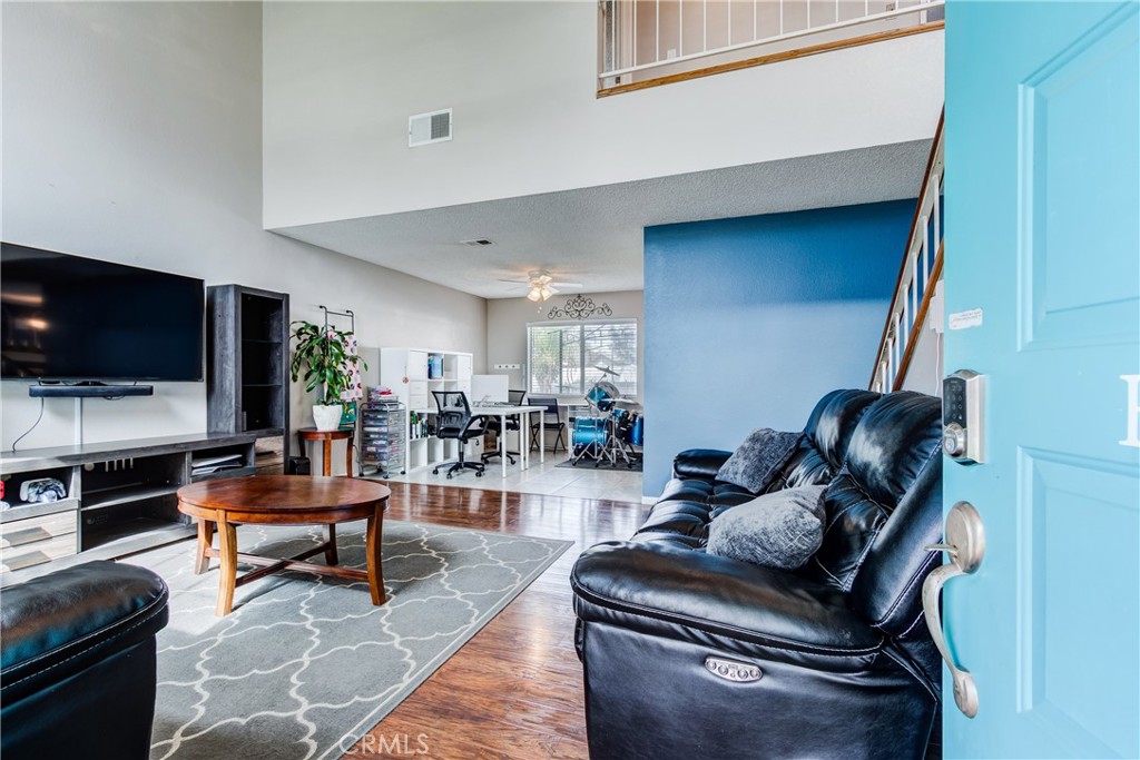 25588 Pelion Road Menifee, CA 92584 - Photo 5 of 43 a living room with furniture and a flat screen tv