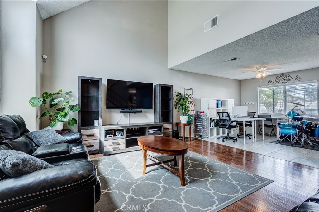 25588 Pelion Road Menifee, CA 92584 - Photo 6 of 43 a living room with furniture and a flat screen tv