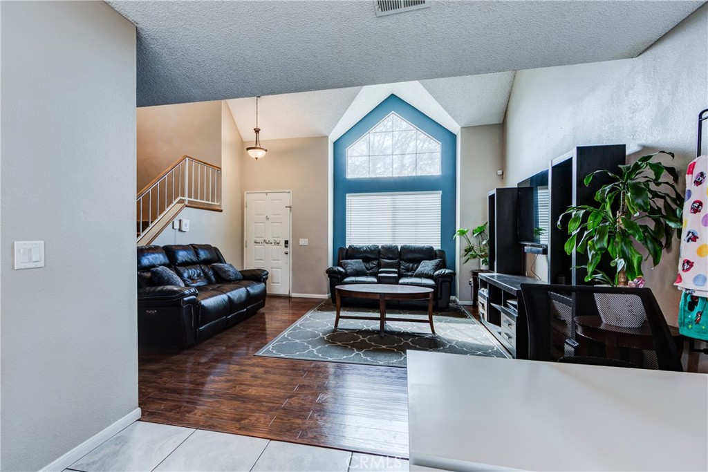 25588 Pelion Road Menifee, CA 92584 - Photo 8 of 43 a living room with furniture and a flat screen tv