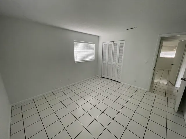 a view of an empty room and window
