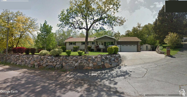 1360 Carterville Road Orem, UT 84097 - Photo 2 of 40 Ranch-style house with a garage, driveway, and a front lawn