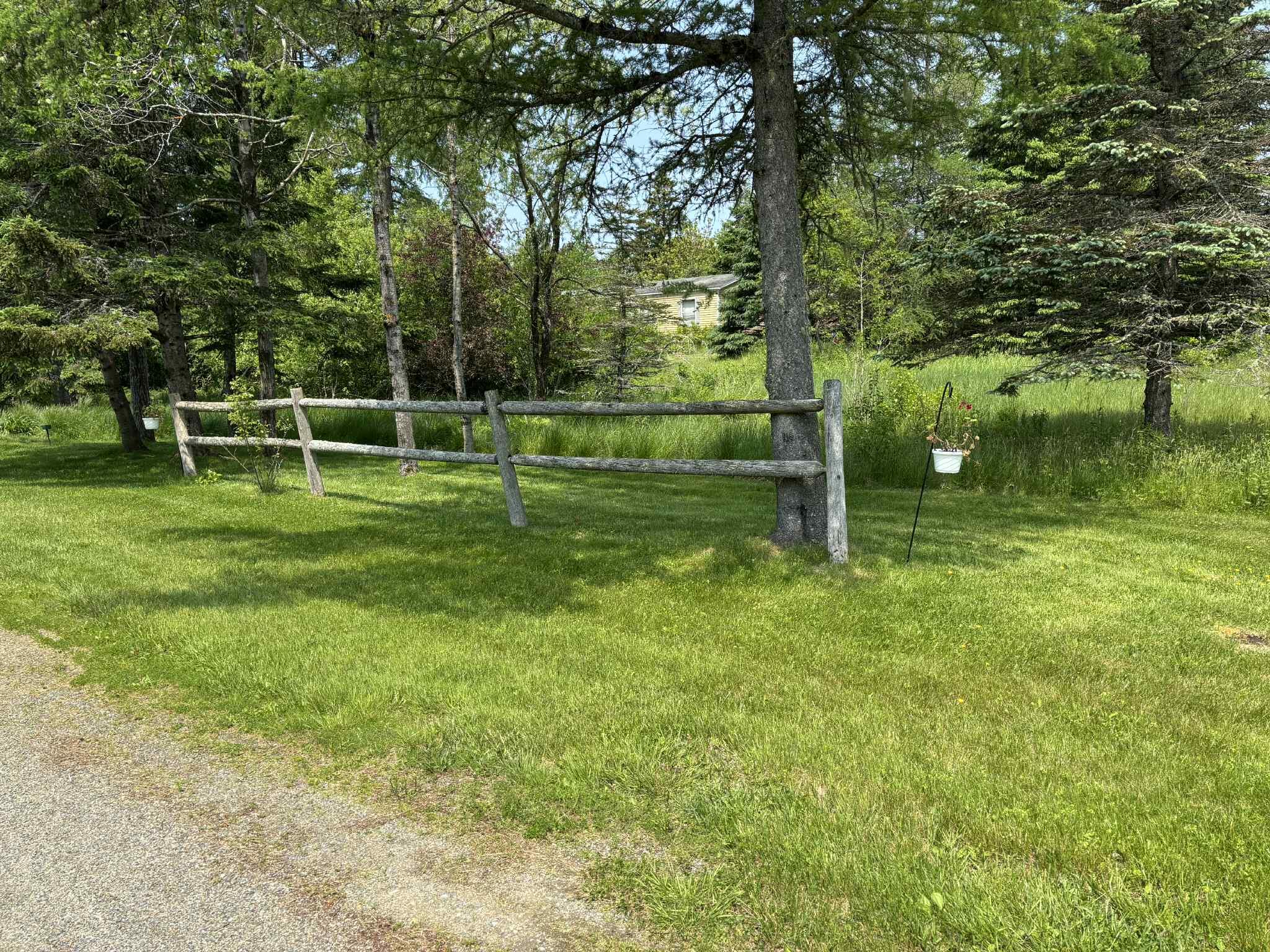 173 Kennebec Road Machias, ME 04654 - Photo 24 of 33 Side yard with fencing
