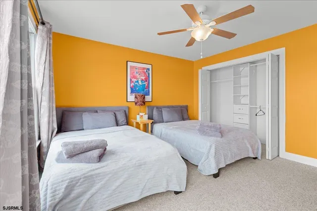 a bathroom with a tub a sink and mirror