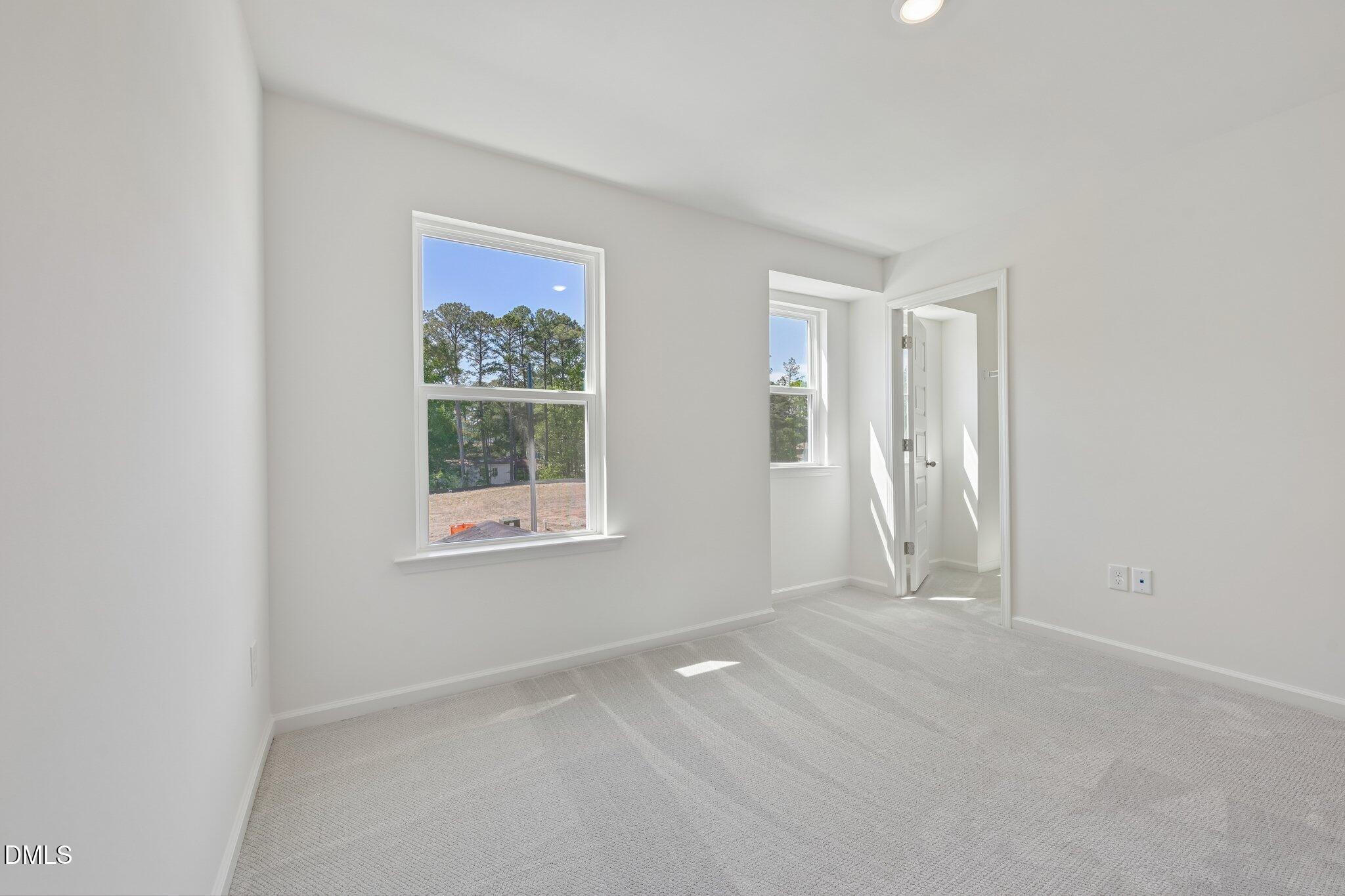 2206 Rabbitbrush Street Durham, NC 27704 - Photo 23 of 49 a view of an empty room with a window