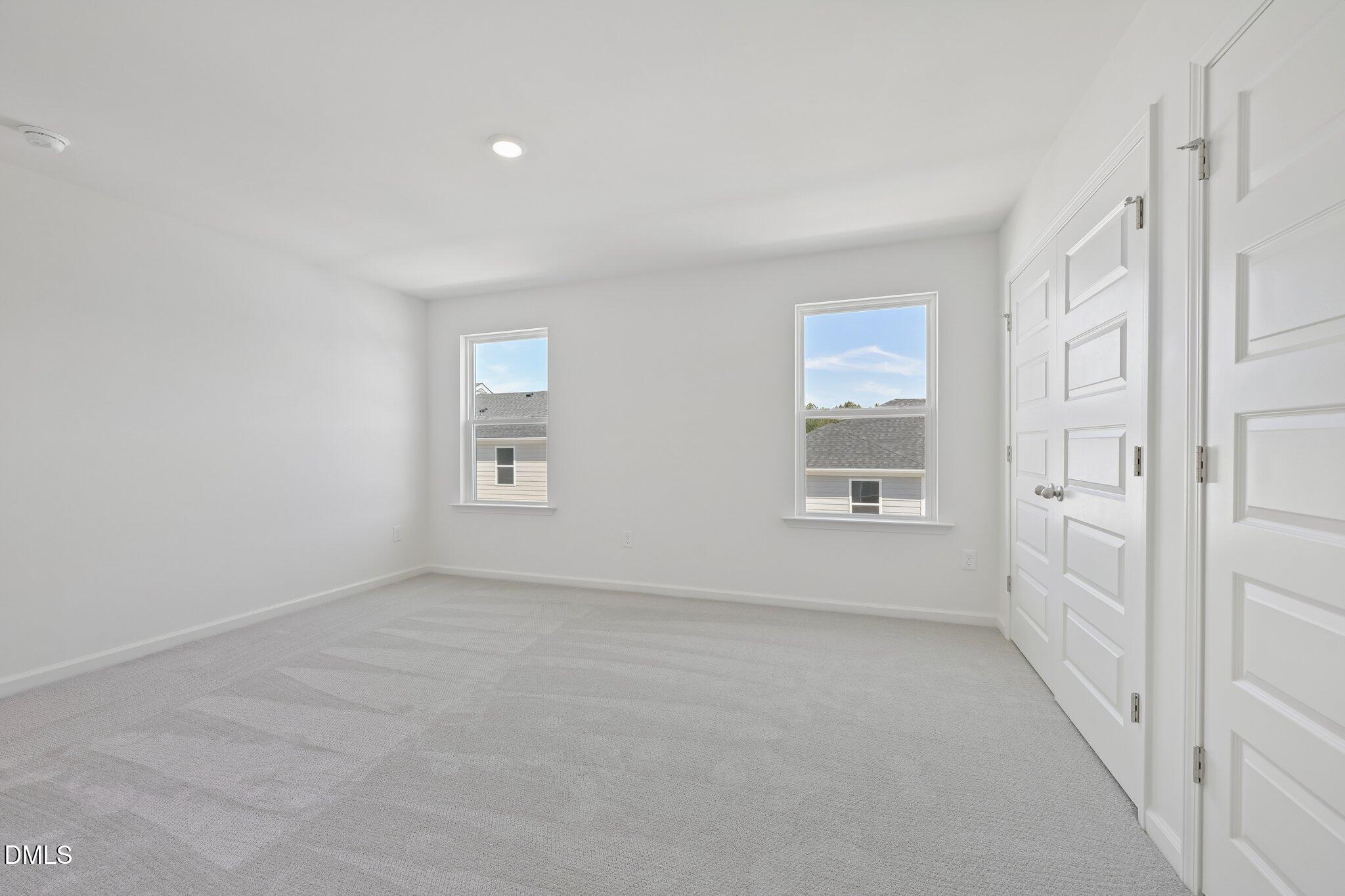 2206 Rabbitbrush Street Durham, NC 27704 - Photo 32 of 49 a view of an empty room with a window