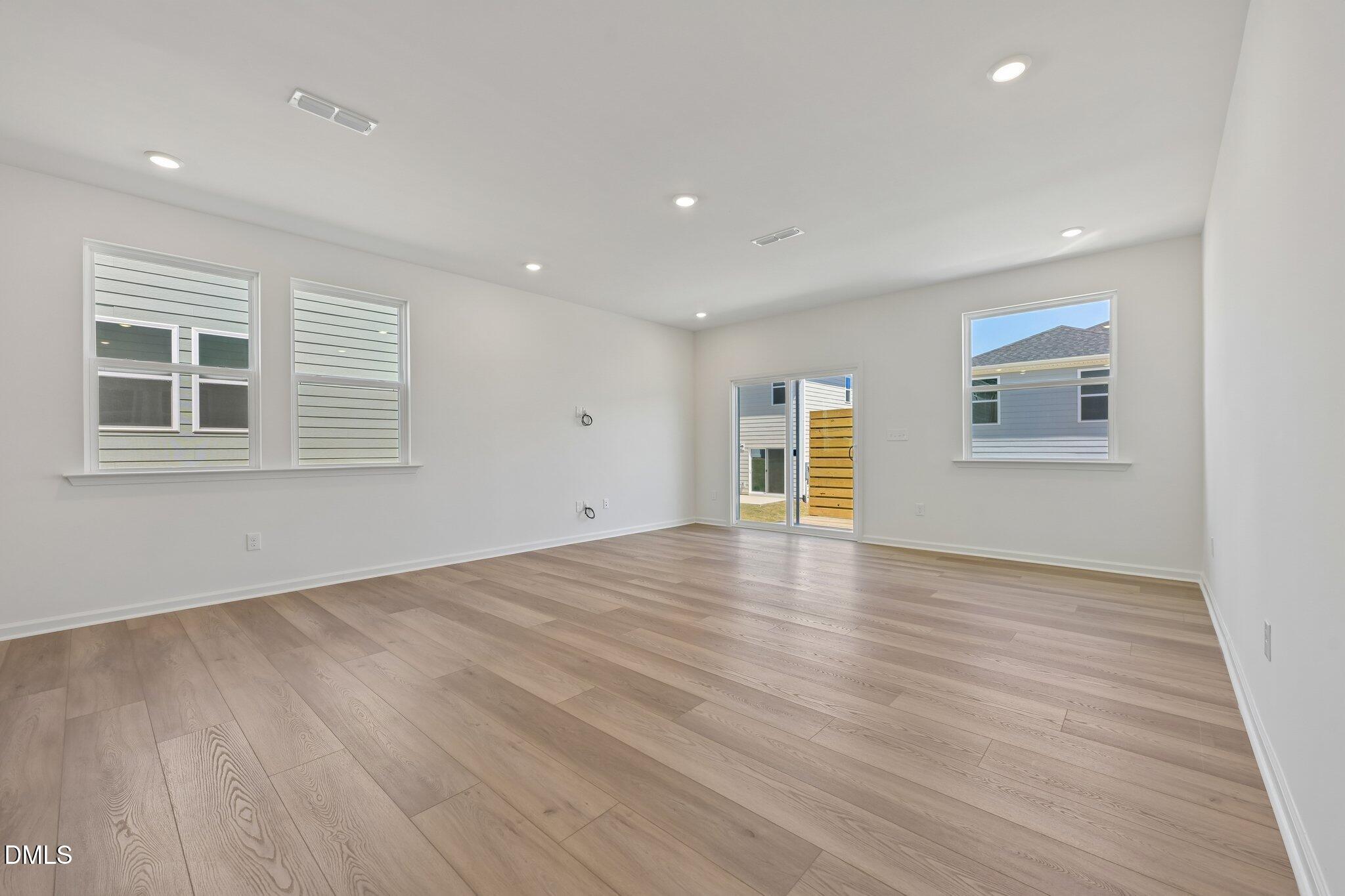 2206 Rabbitbrush Street Durham, NC 27704 - Photo 8 of 49 a view of a livingroom with wooden floor and window