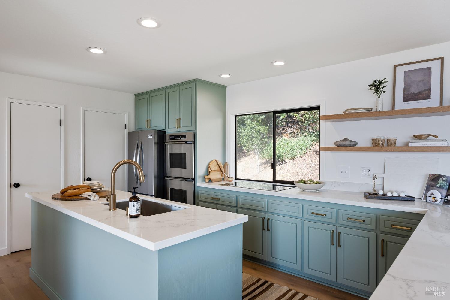 115 Geldert Drive Tiburon, CA 94920 - Photo 12 of 57 a kitchen with sink cabinets and refrigerator