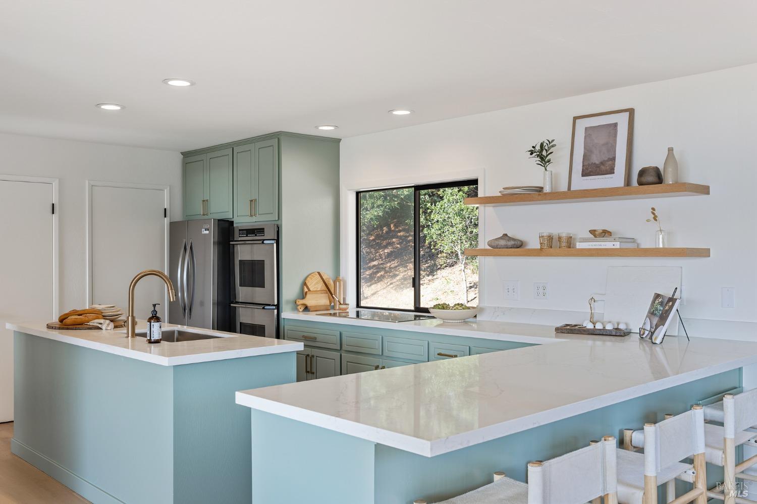 115 Geldert Drive Tiburon, CA 94920 - Photo 18 of 57 a kitchen with a sink and a refrigerator