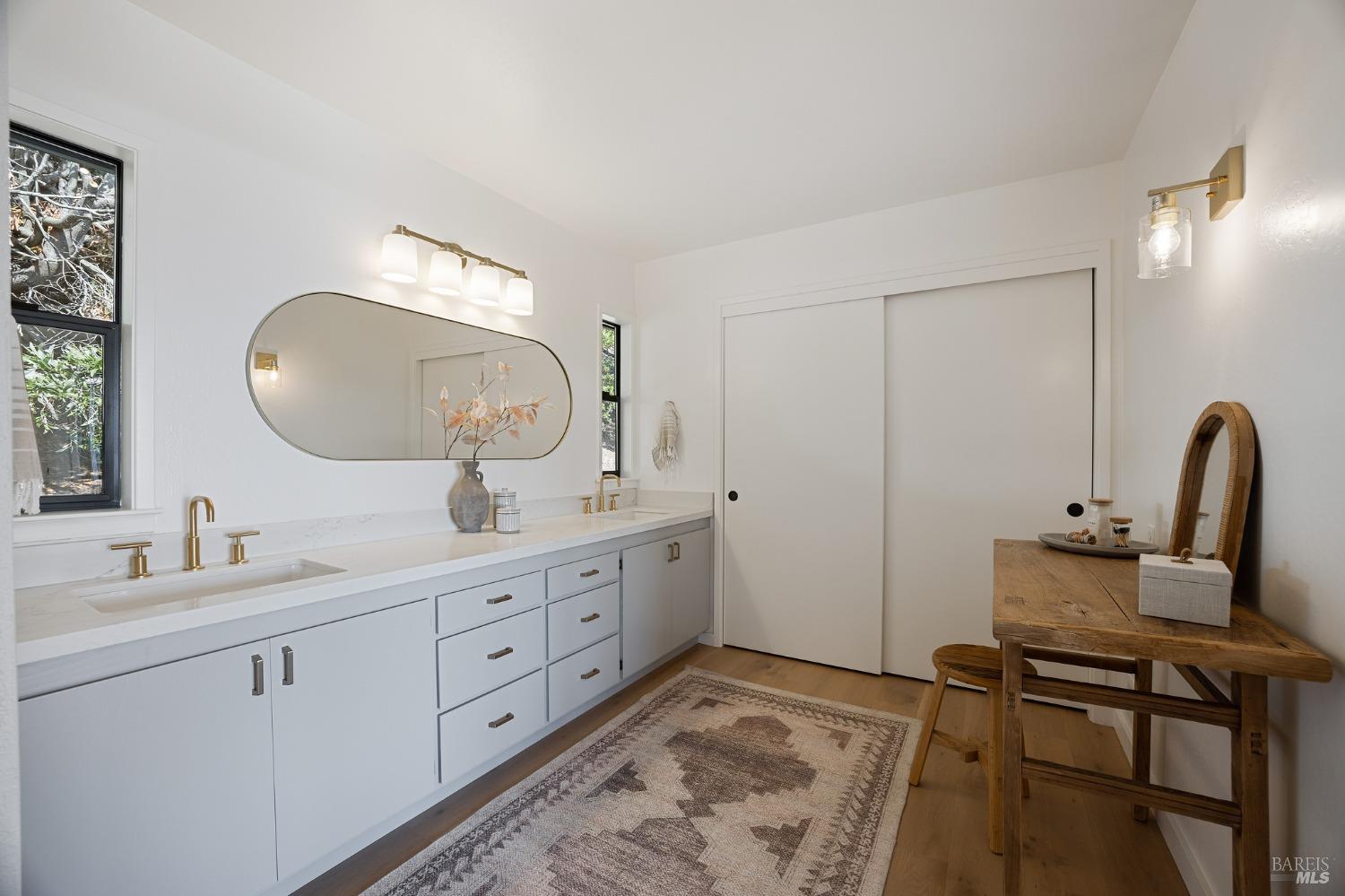 115 Geldert Drive Tiburon, CA 94920 - Photo 29 of 57 a spacious bathroom with a double vanity sink and a mirror