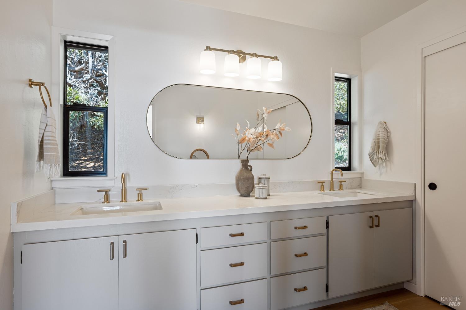 115 Geldert Drive Tiburon, CA 94920 - Photo 30 of 57 a bathroom with a double vanity sink and a mirror