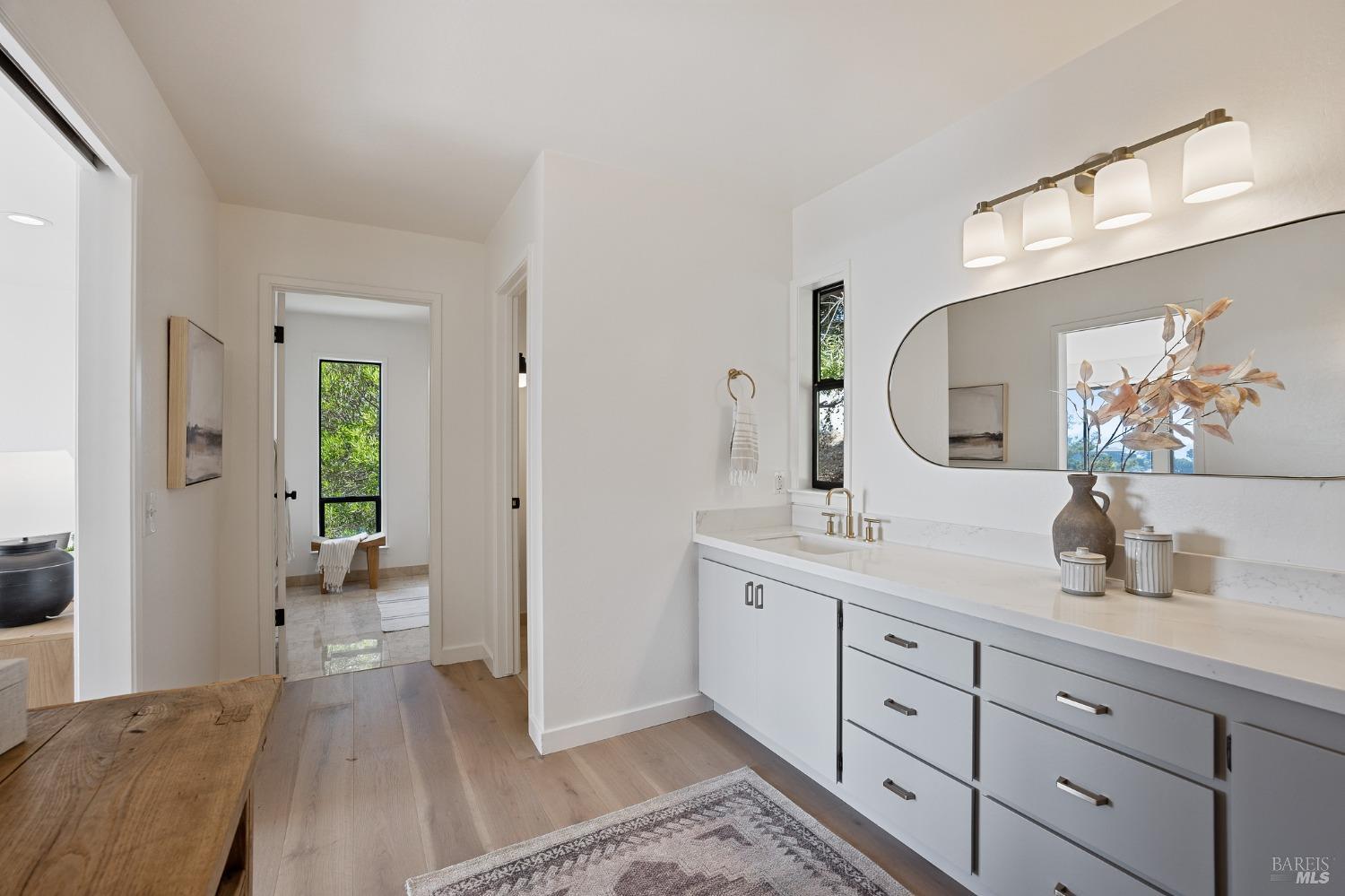 115 Geldert Drive Tiburon, CA 94920 - Photo 31 of 57 a spacious bathroom with a double vanity sink and a mirror