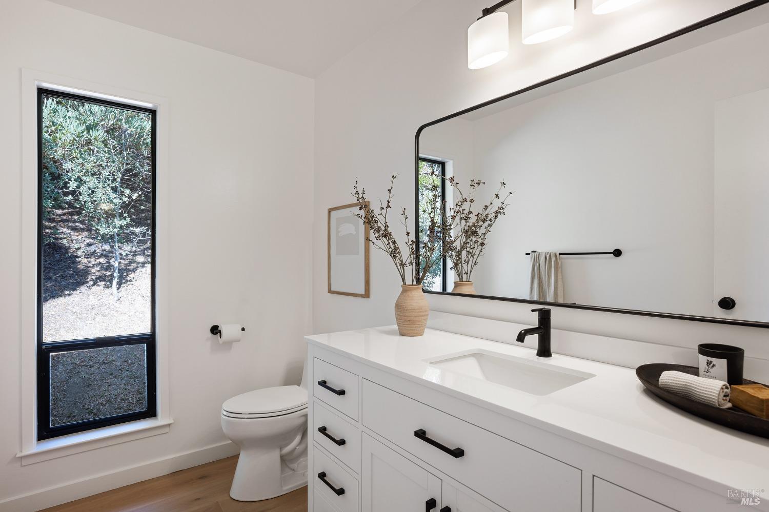 115 Geldert Drive Tiburon, CA 94920 - Photo 33 of 57 a bathroom with a granite countertop sink toilet and mirror
