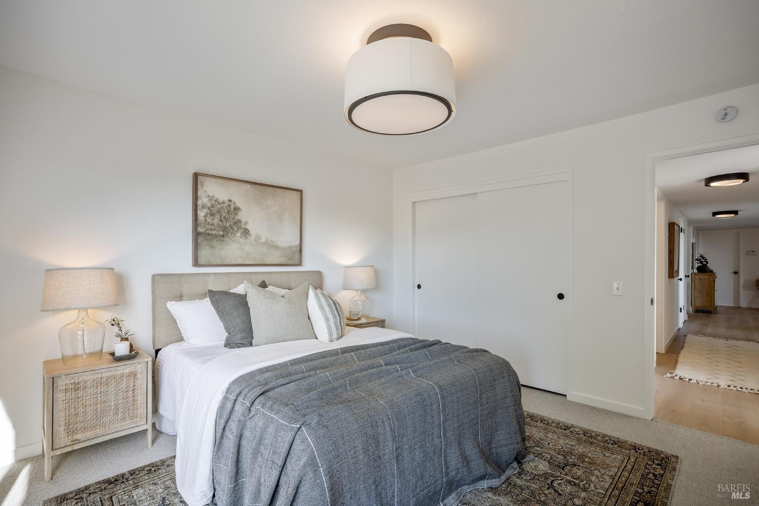 115 Geldert Drive Tiburon, CA 94920 - Photo 39 of 57 a bedroom with a bed and a lamp