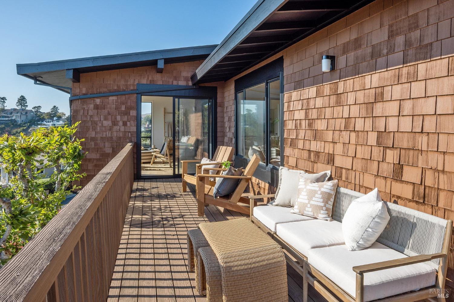 115 Geldert Drive Tiburon, CA 94920 - Photo 44 of 57 a view of a patio with couches table and chairs and potted plants