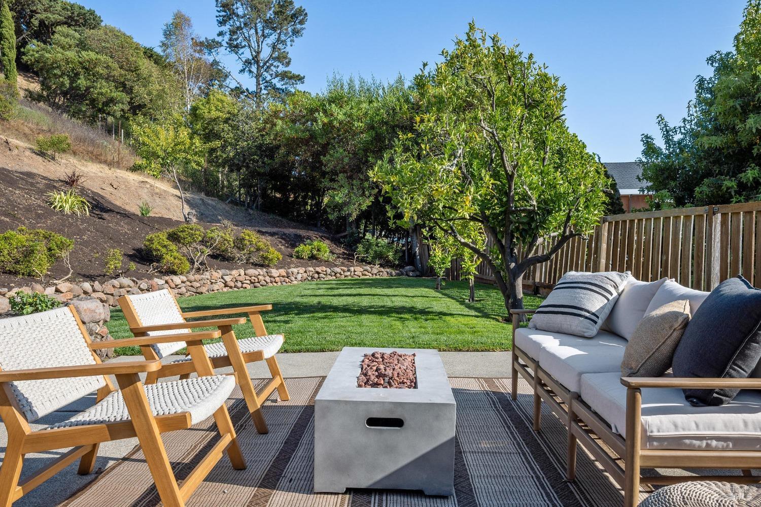 115 Geldert Drive Tiburon, CA 94920 - Photo 46 of 57 a view of a patio with couches chairs and a yard