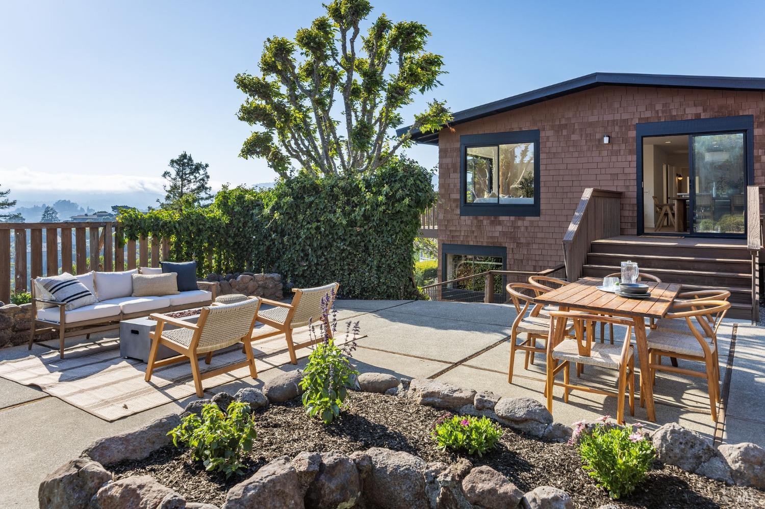 115 Geldert Drive Tiburon, CA 94920 - Photo 48 of 57 a view of a patio with table and chairs and potted plants