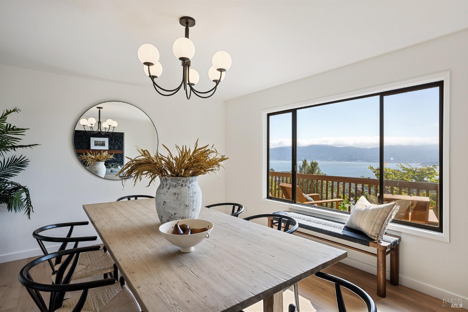 115 Geldert Drive Tiburon, CA 94920 - Photo 10 of 57 a view of a dining room with furniture a chandelier and wooden floor