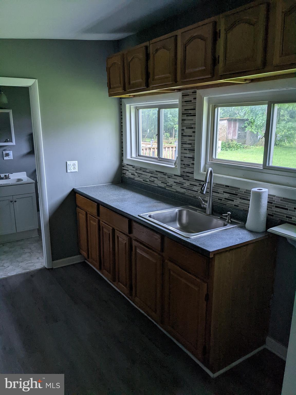 79 Spotts Mill Road Douglassville, PA 19518 - Photo 18 of 27 a kitchen with stainless steel appliances a sink stove and cabinets