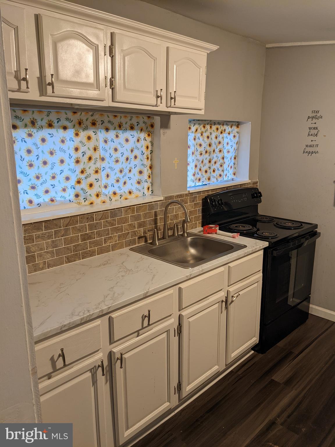 79 Spotts Mill Road Douglassville, PA 19518 - Photo 21 of 27 a close view of a sink a microwave and cabinets